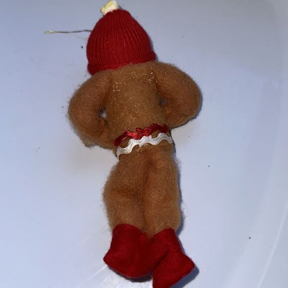 Vintage bendable smiling fuzzy gingerbread man ornament with red cap - Picture 8 of 10